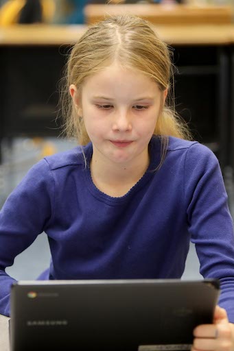 Student using a laptop in class